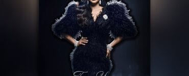 Promotional poster showing a woman in a black fur gown with statement jewelry; text reads 'For You NOURUL' at the bottom.